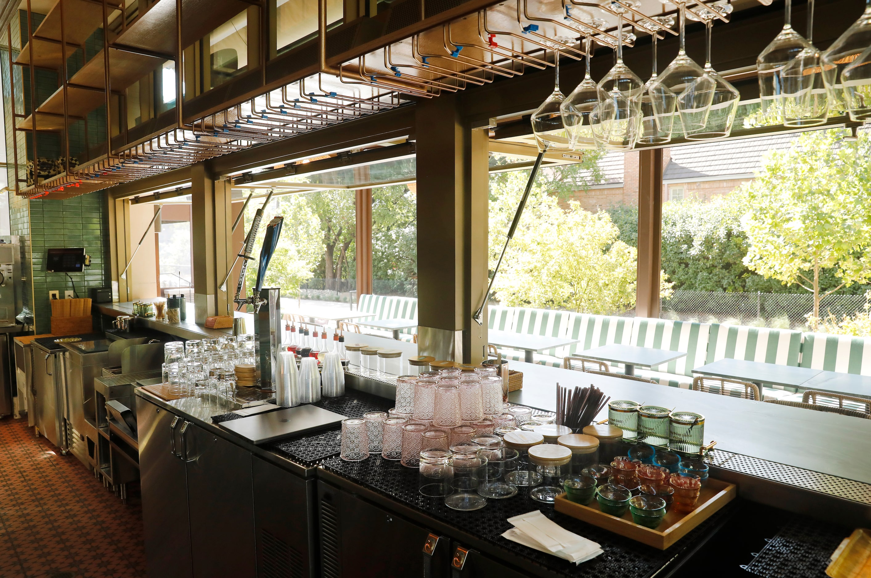 An interior view looking out at the patio and Katy Trail at Rose Café Tasting, October 2, 2024.