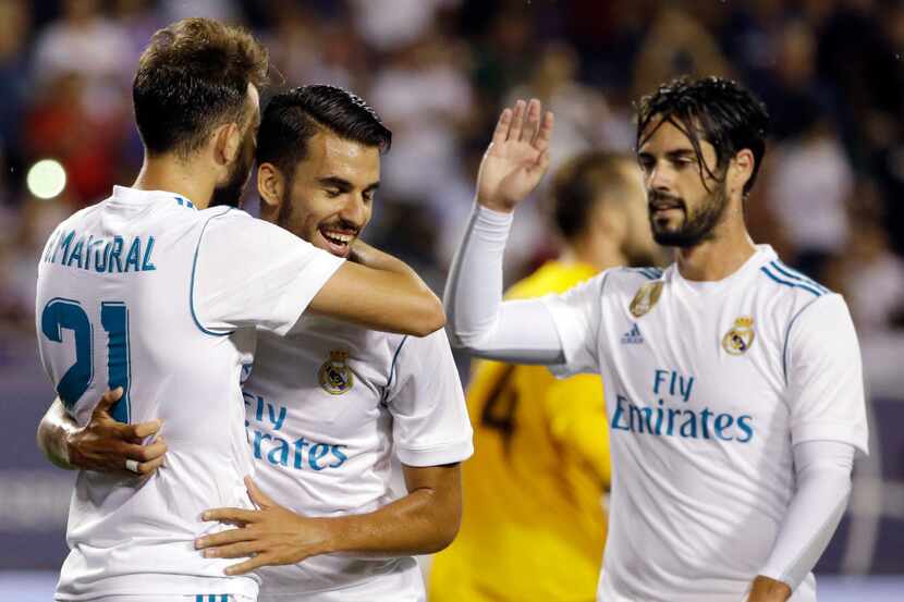 Real Madrid's Borja Mayoral, left, celebrates with Dani Ceballos, center, and Isco after...