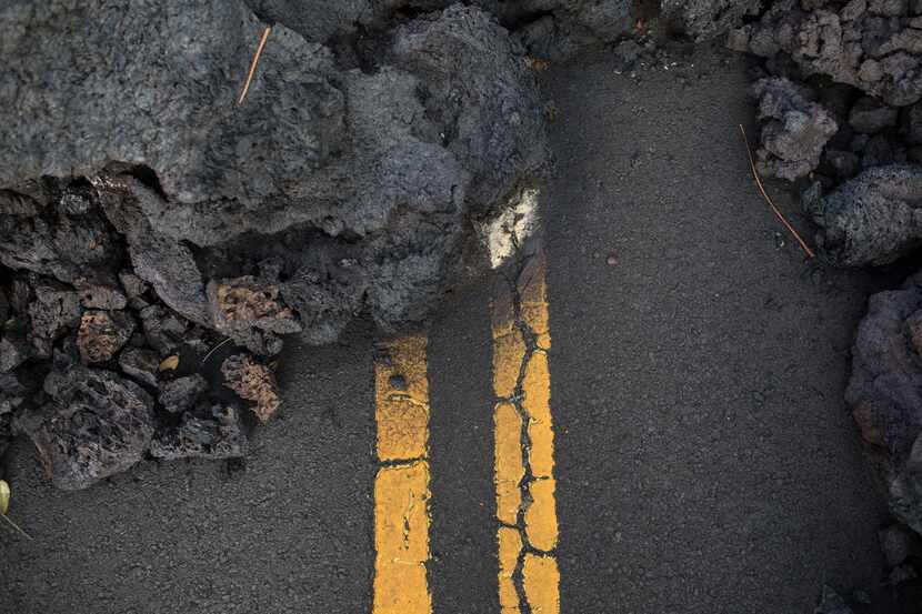 Hardened lava flow blocks Leilani Avenue in the Leilani Estates subdivision near Pahoa,...