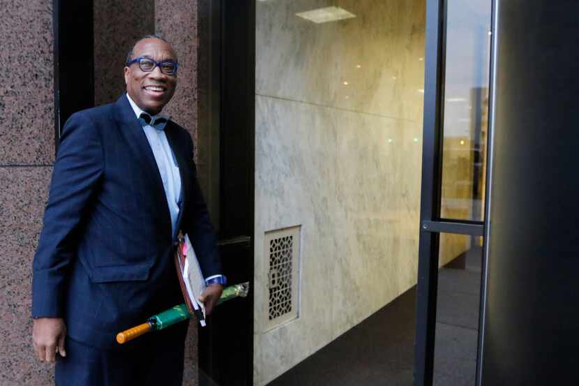 Dallas County Commissioner John Wiley Price smiles to a friend as he enters the Earle Cable...