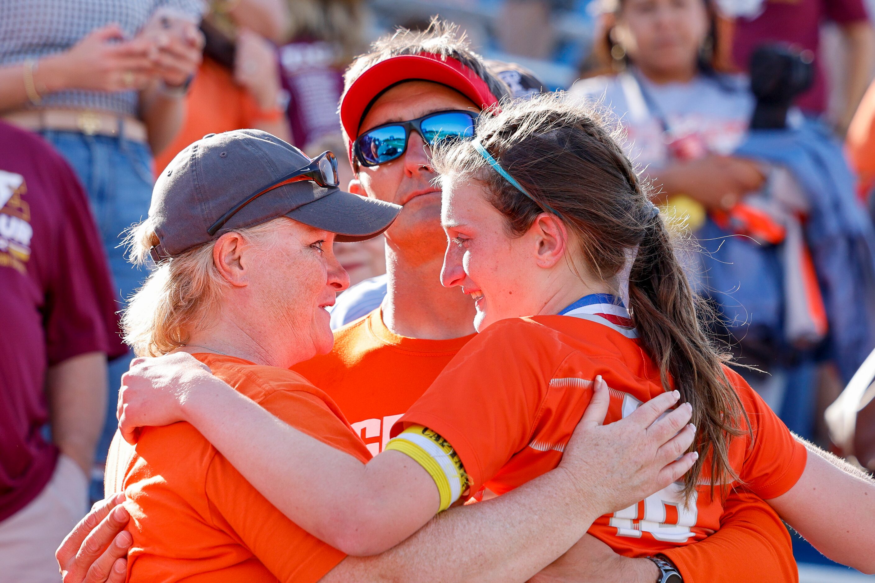 Celina forward Taylor Zdrojewski (16) hugs her parents Colleen Zdrojewski (left) and Rich...