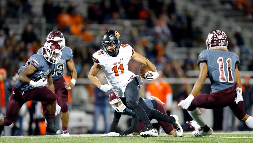 Rockwall wide receiver Jaxon Smith-Njigba (11) breaks away for a big catch and run during...
