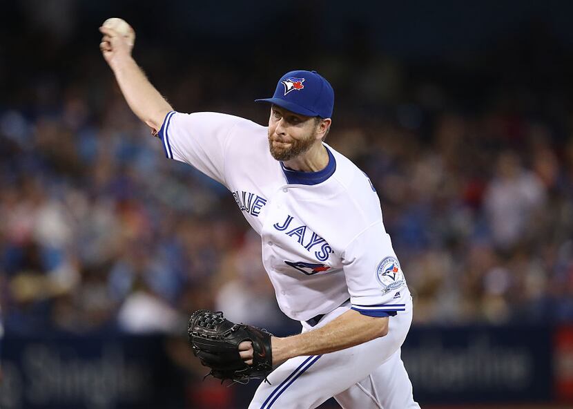 TORONTO, CANADA - AUGUST 12: Scott Feldman #46 of the Toronto Blue Jays delivers a pitch in...