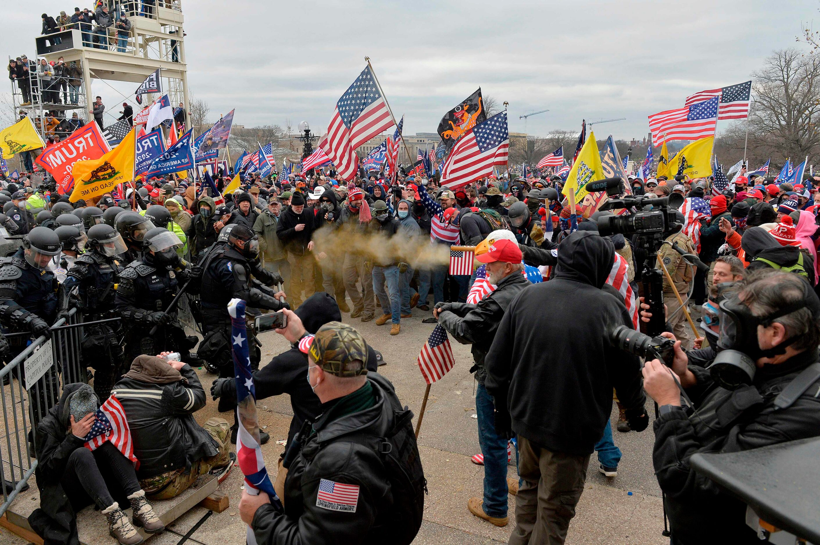 TOPSHOT - Trump supporters clash with police and security forces as they storm the US...