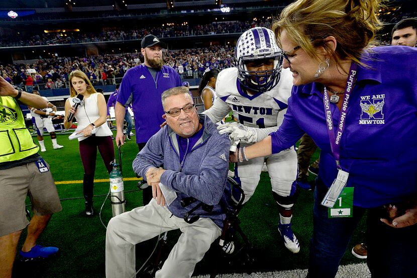 In this Thursday, Dec. 20, 2018, Newton's head coach W.T. Johnston is congratulated after...