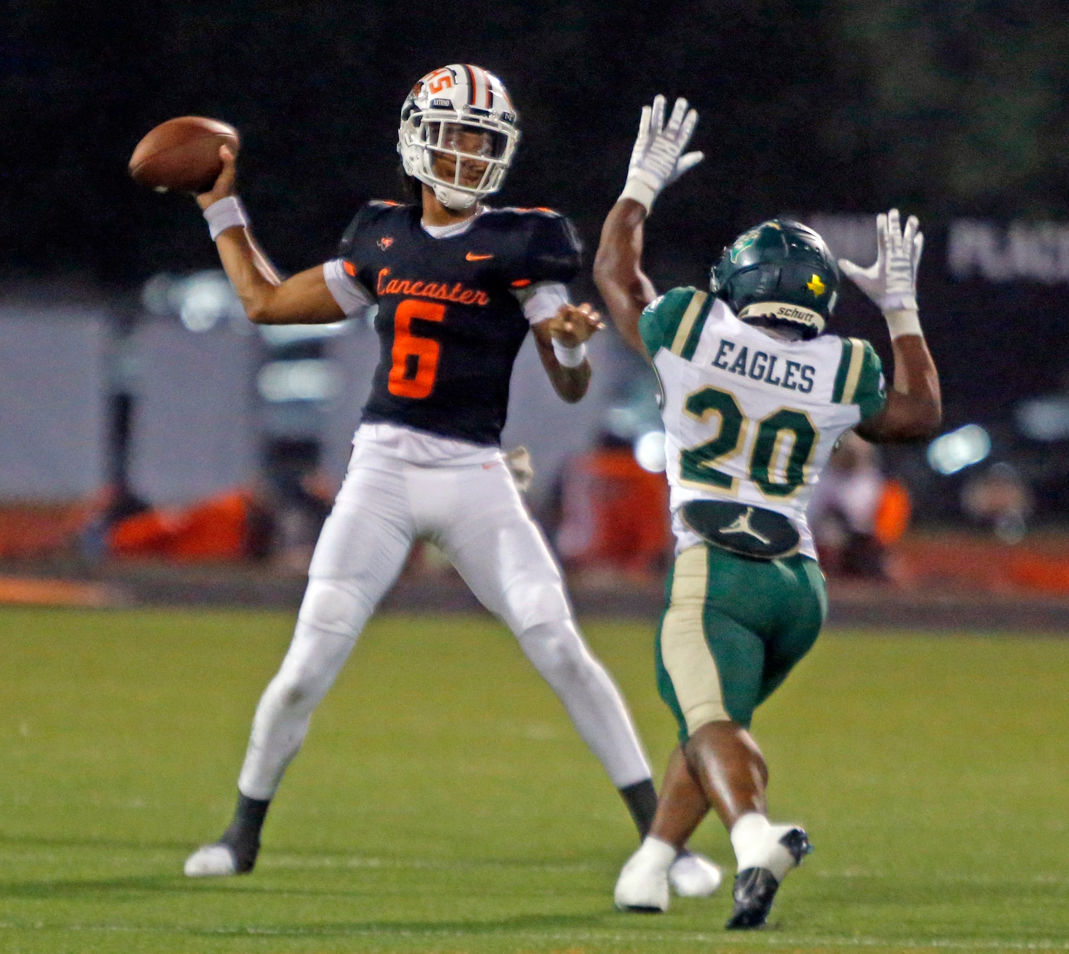 DeSoto High defender Jace Hill-Douglas (20) pressures Lancaster High QB Carter Jones (6)...