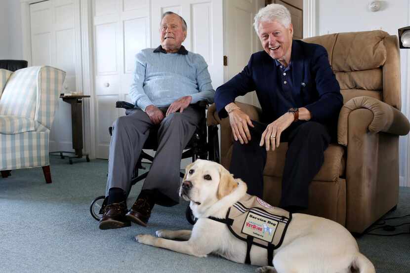 Former Republican President George H.W. Bush (left) and his visitor, former President Bill...