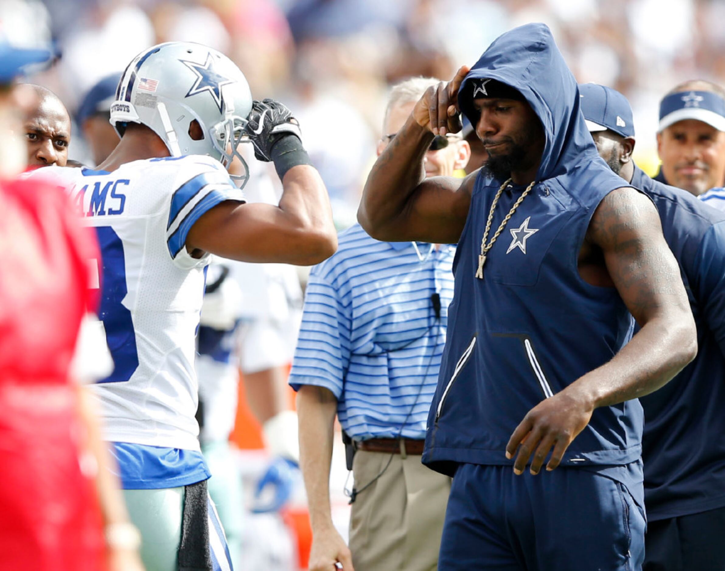 FILE - In this May 7, 2016, file phoito, Dallas Cowboys wide receiver Dez  Bryant tosses the ball as he watches rookies work out during the team's NFL  football minicamp in Irving