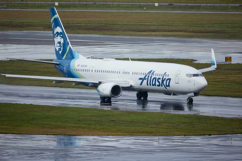 Alaska Airlines flight 1276, a Boeing 737-900, taxis before takeoff from Portland...