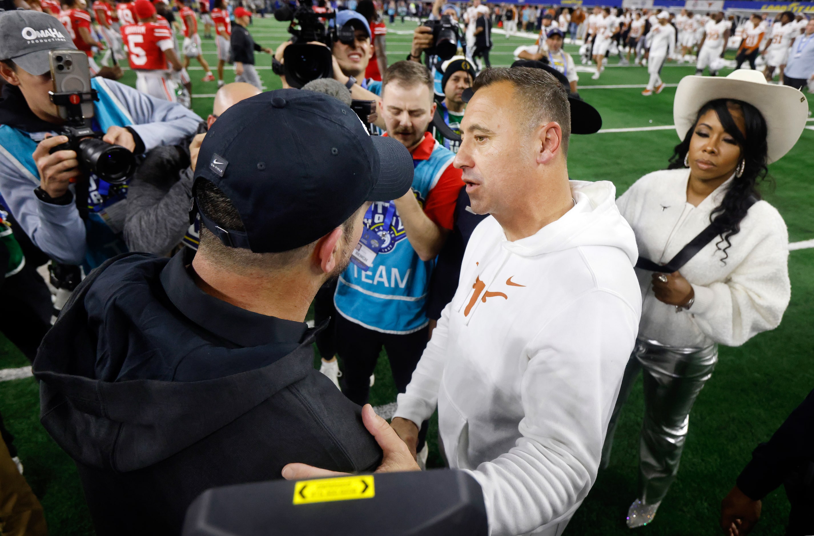 Texas Longhorns head coach Steve Sarkisian (right) congratulates Ohio State Buckeyes head...