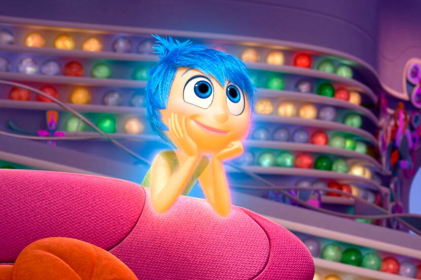 In this image released by Disney-Pixar, the character Joy, voiced by Amy Poehler, appears in...