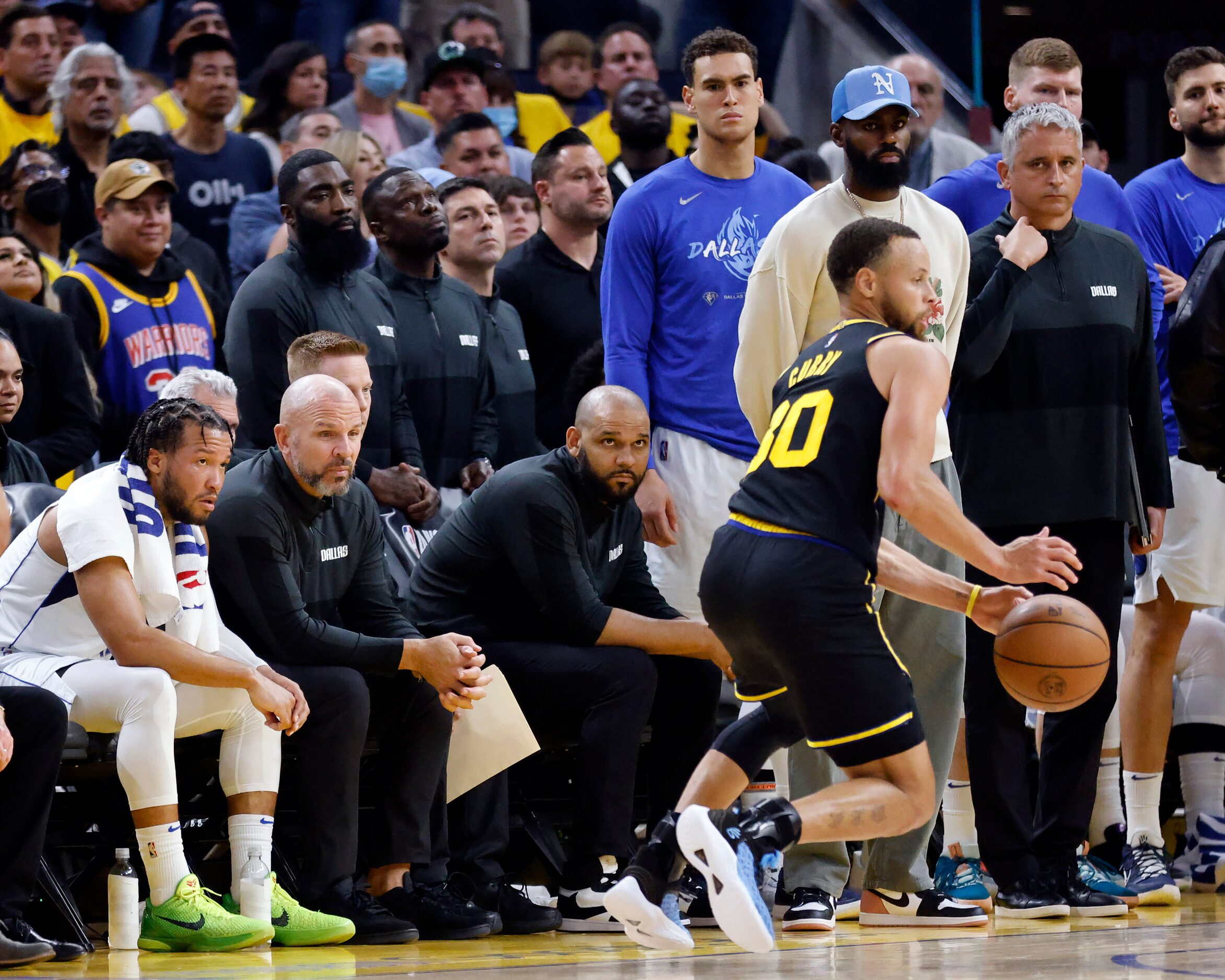 Dallas Mavericks guard Jalen Brunson (left), head coach Jason Kidd and the rest of the bench...