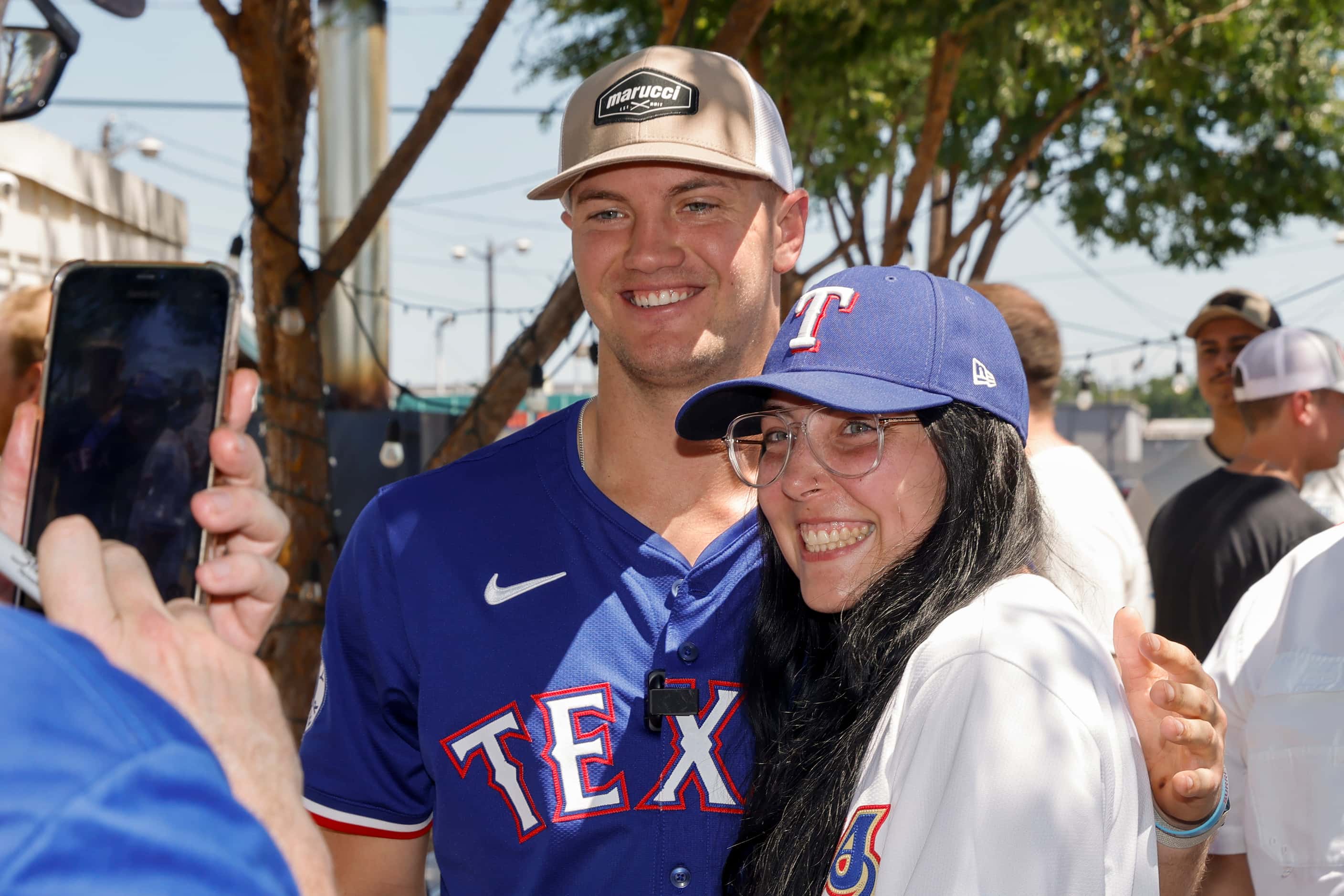 Texas Rangers third baseman Josh Jung poses for a photo with Kate Criswell at Hurtado...