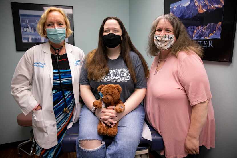 From left: Dr. Lee Pearse, Lacie Mitchell and Cindy Mitchell pose in an examination room...
