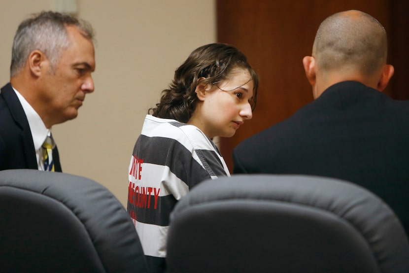 FILE - Gypsy Rose Blanchard speaks with her attorney's Mike Stanfield, right, and Clate...