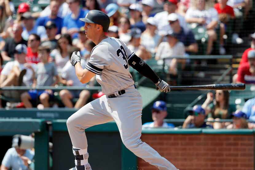 New York Yankees' Greg Bird follows through on a single in the fifth inning of a baseball...