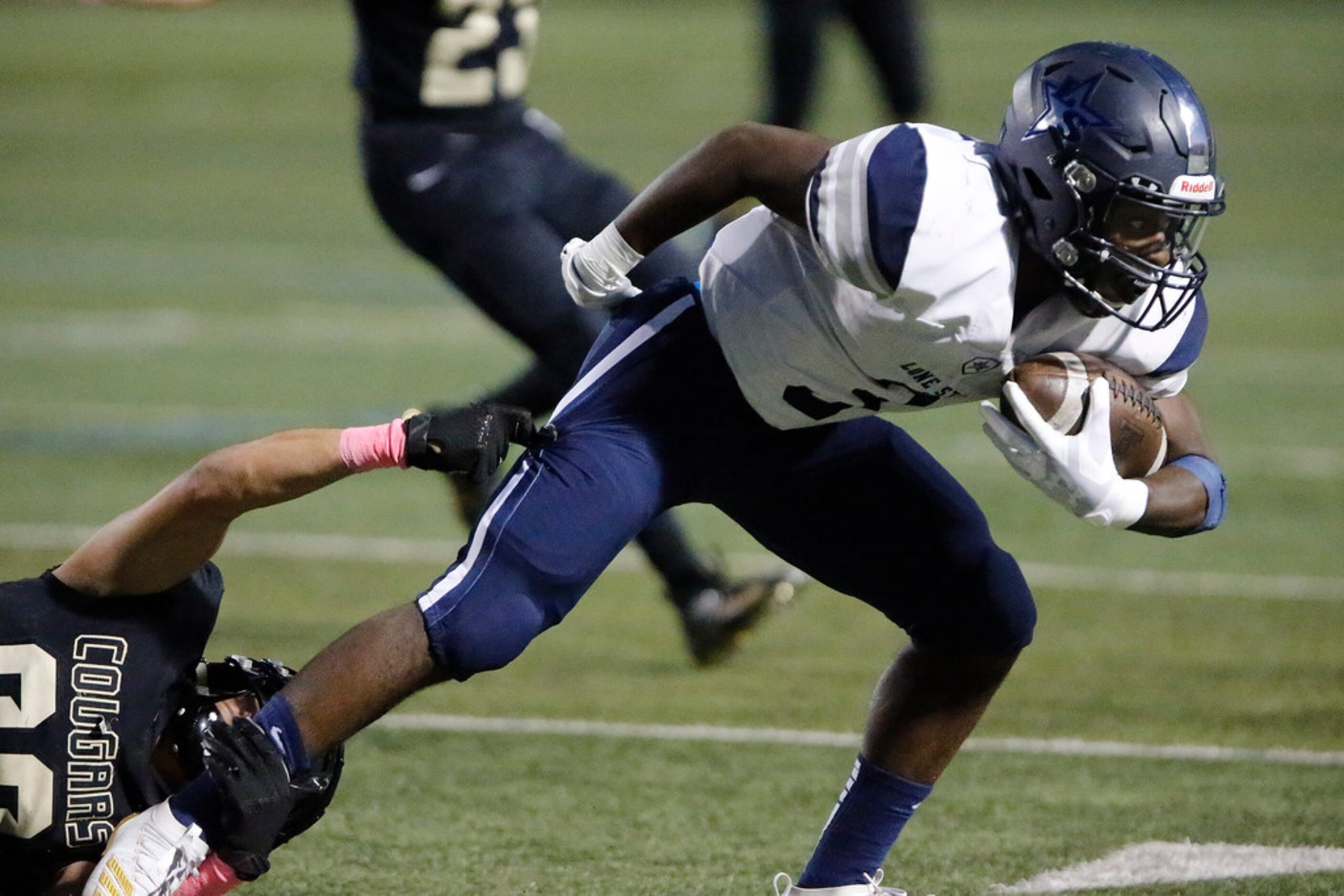 Lone Star High School wide receiver Tolu Sokoya (3) shakes off The Colony High School...