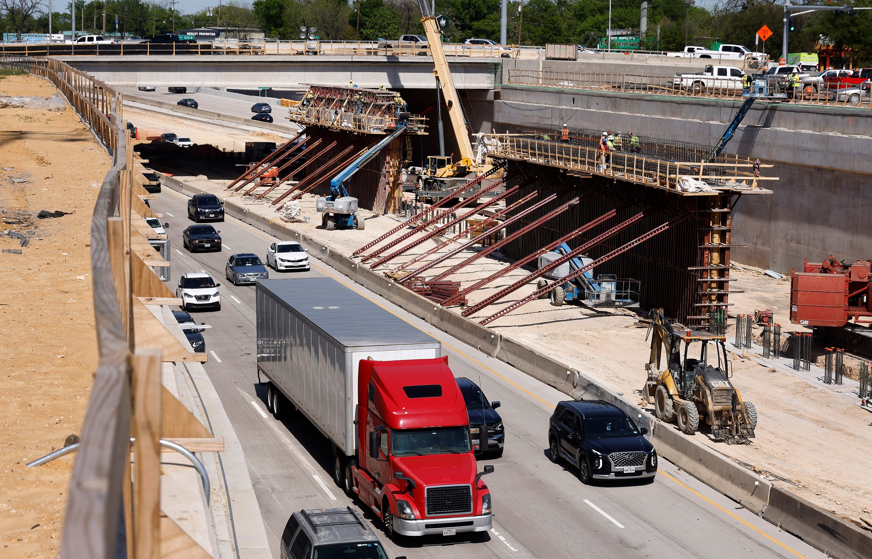 Crews construct support structures for the $172 million Southern Gateway Park on Interstate...