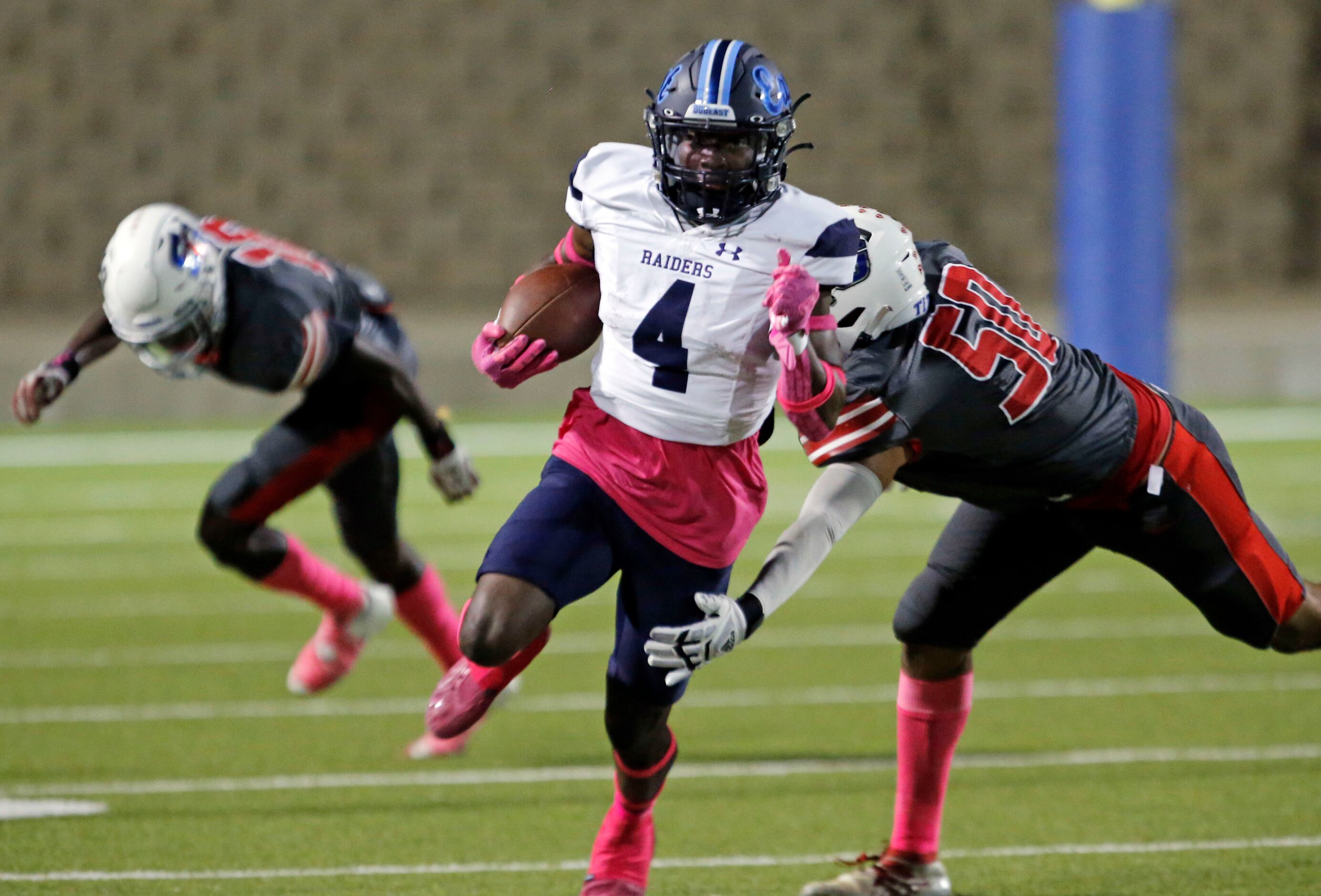 Wylie East high’s Tristan Lee (4) picks up a first down, as he gets by South Garland...