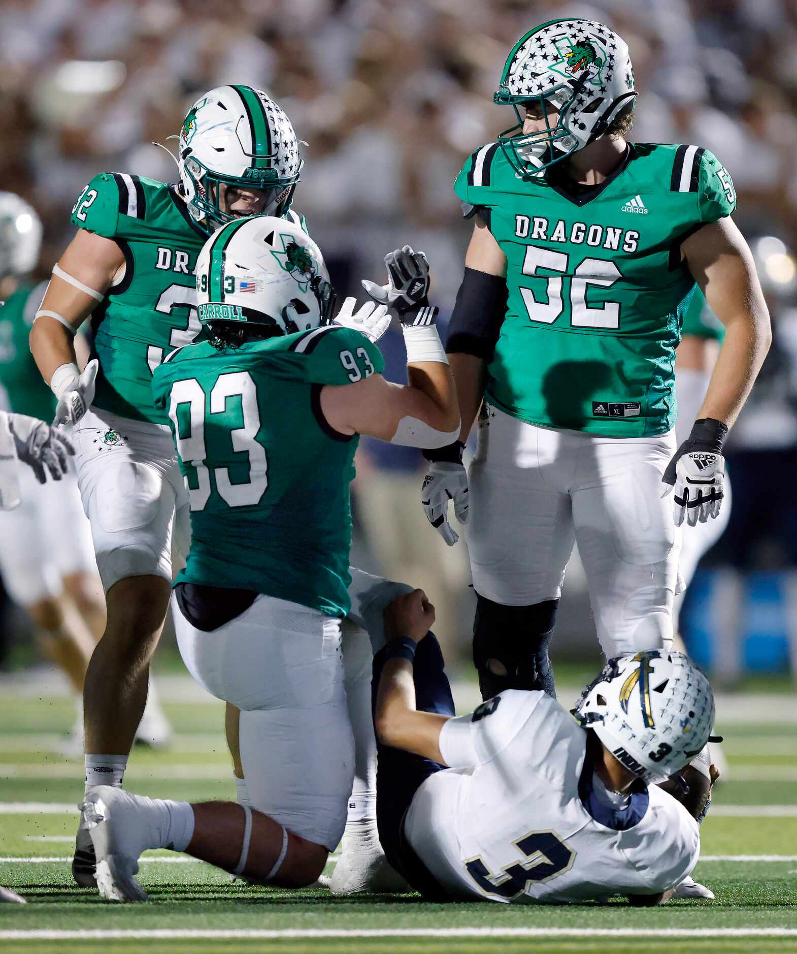 Southlake Carroll lineman Zach Scarborough (93) is congratulated on his fourth quarter sack...