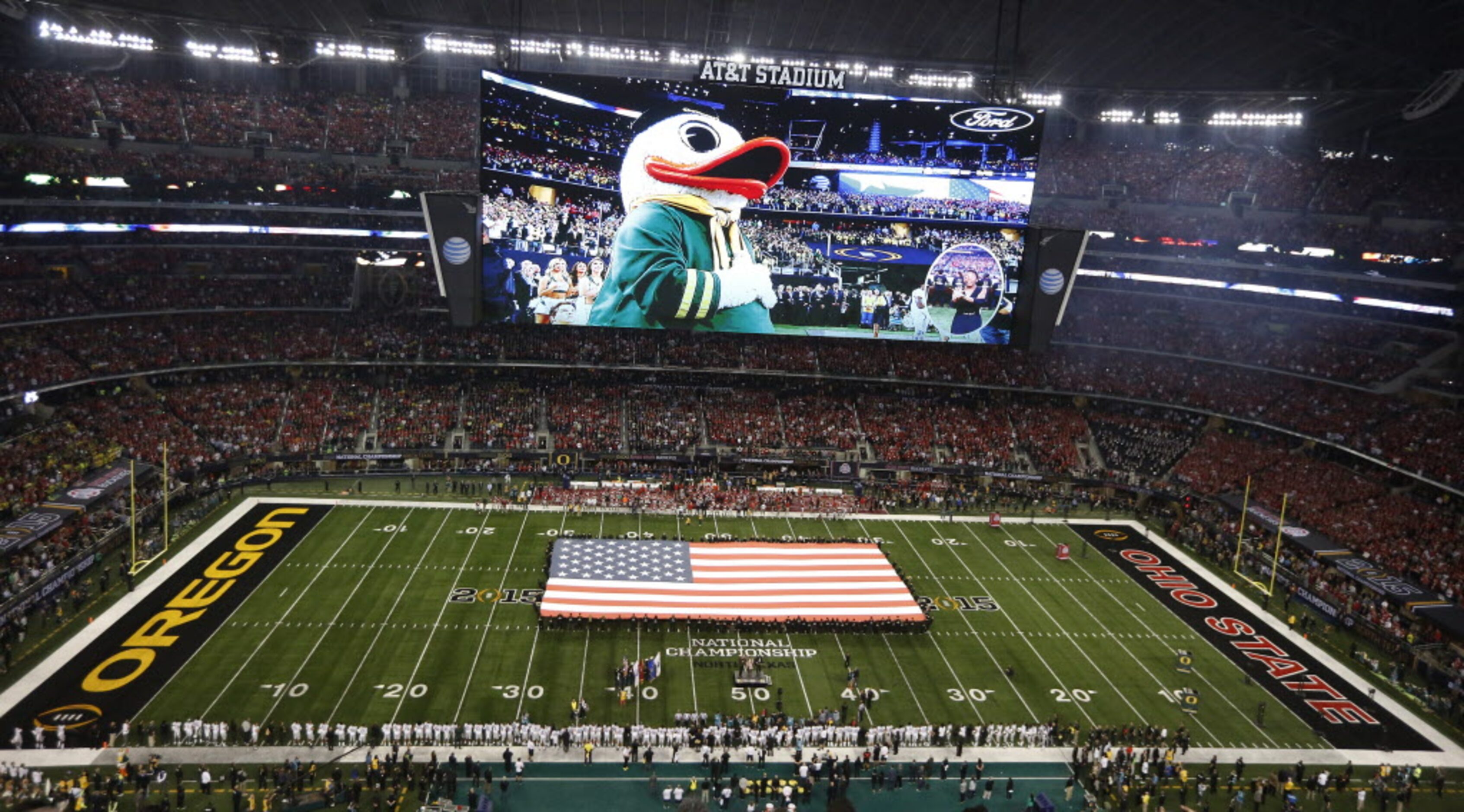 Lady Antebellum performs the United State National Anthem before the College Football...