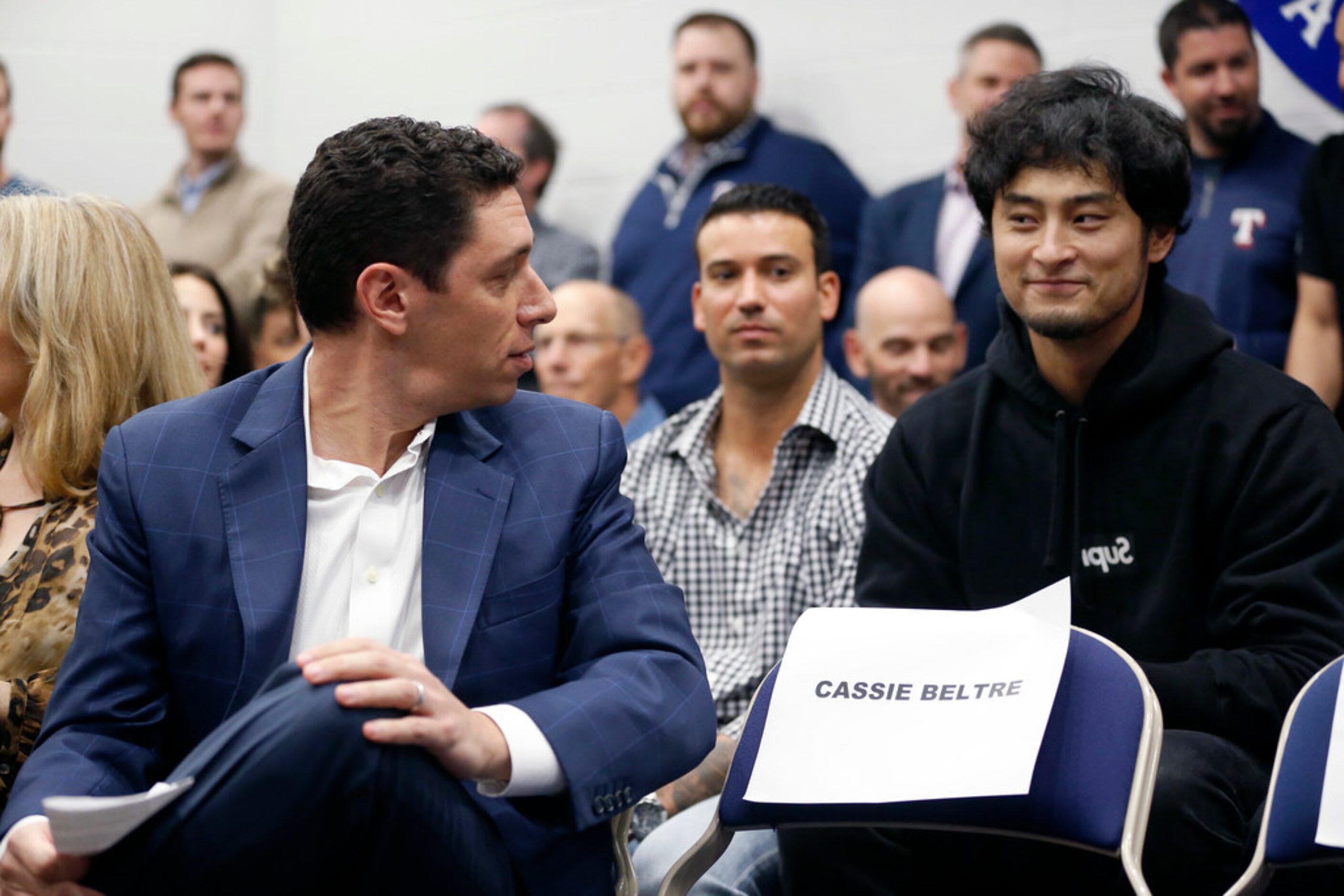 Texas Rangers manager Jon Daniels (left) visits with former Texas Rangers pitcher Yu Darvish...