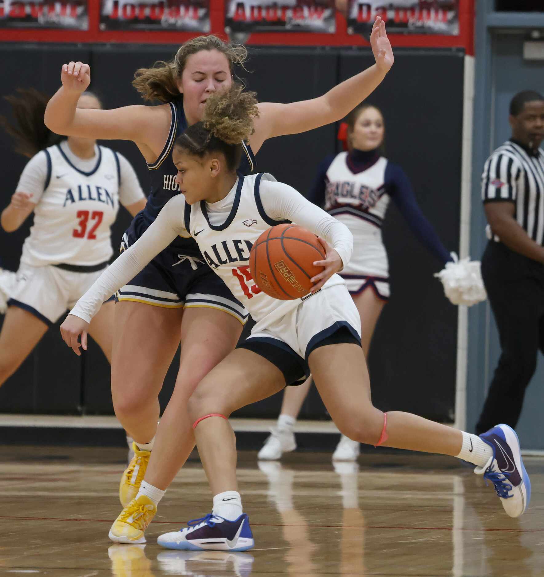 Allen guard Simone Richmond (15) drives against the defense of Highland Park post Cate Young...