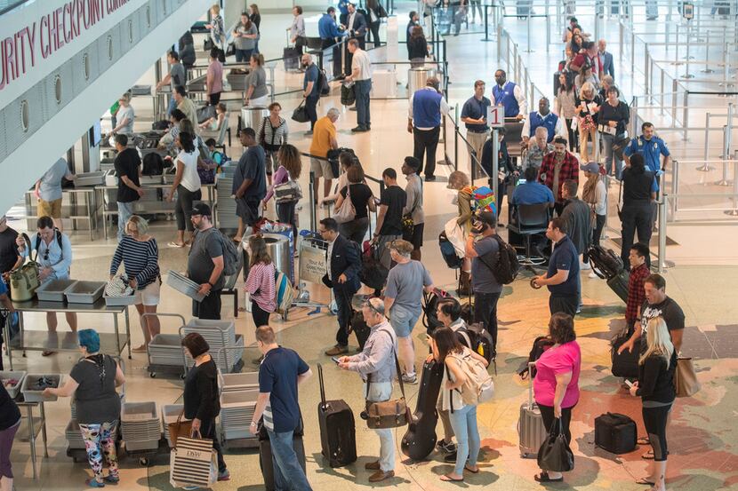 Airline Passengers wait in the TSA security line at Dallas Love Field on Wednesday, May 23,...