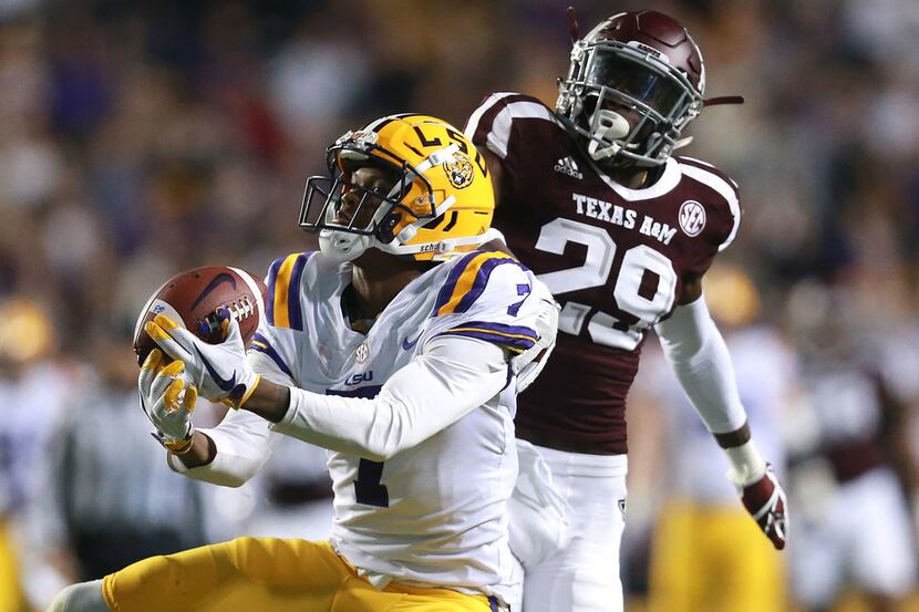 Editor's BATON ROUGE, LA - NOVEMBER 25: Donte Jackson #1 of the LSU Tigers catches a pass...