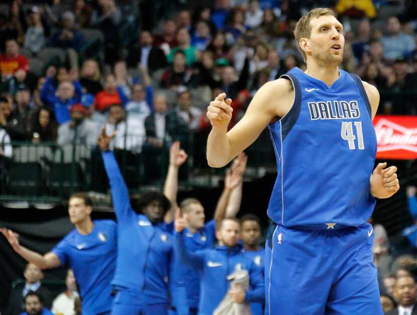 Dallas Mavericks forward Dirk Nowitzki (41) watches as his shot finds the net during the...
