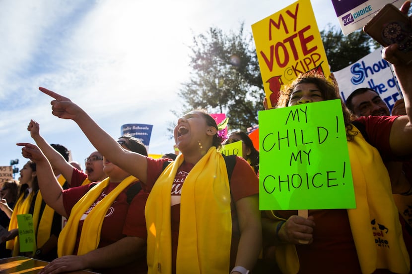 Demonstrators rally to show their support for expanding school choice options during...