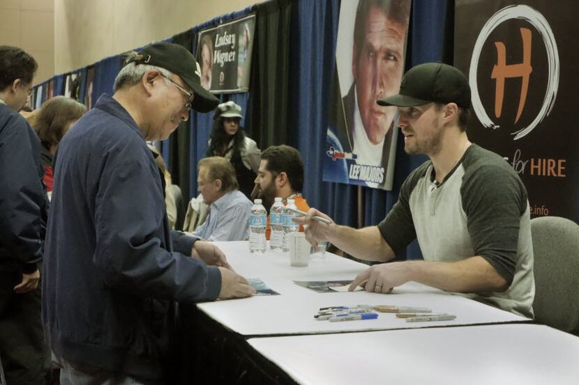 Irving Oishi, left, of San Francisco, California meets Arrow star Stephen Amell at the...
