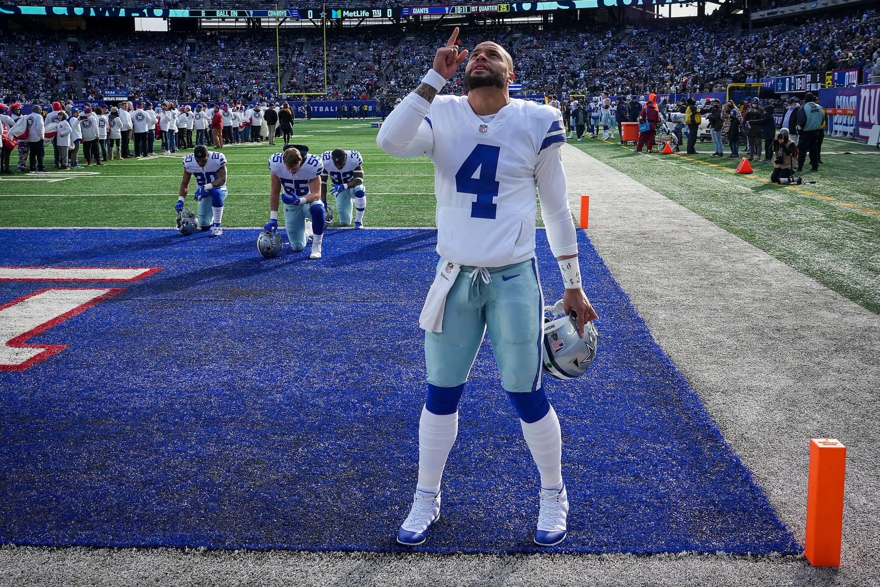 Dallas Cowboys quarterback Dak Prescott pauses in the corner of the end zone before the...