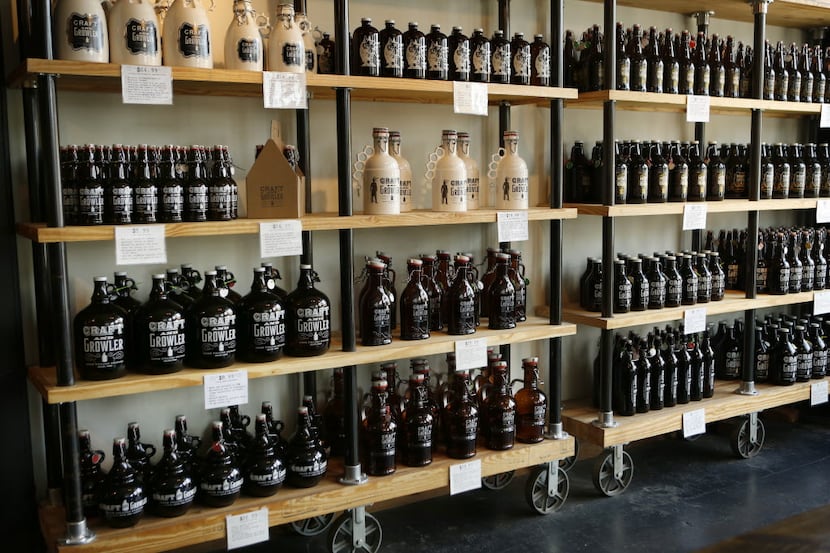 Growlers for sale at Craft & Growler, photographed September 26, 2014. 