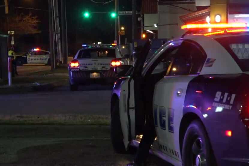 Dallas police vehicles converge at Park Lane near Greenville Avenue where a man was injured...