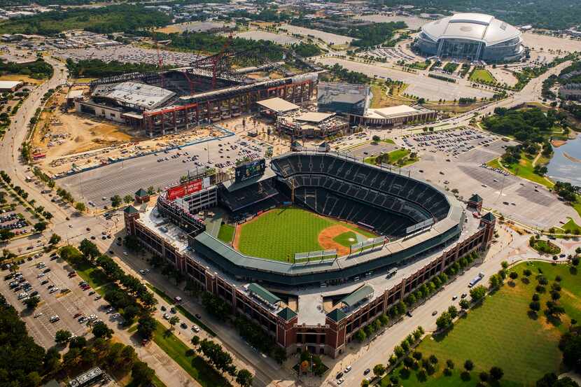 Aerial view of Globe Life Park (bottom), the Texas Live! and Live! by Loews hotel (center),...