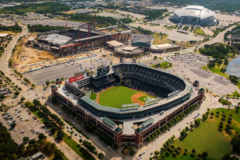 Aerial view of Globe Life Park (bottom), the Texas Live! and Live! by Loews hotel (center),...