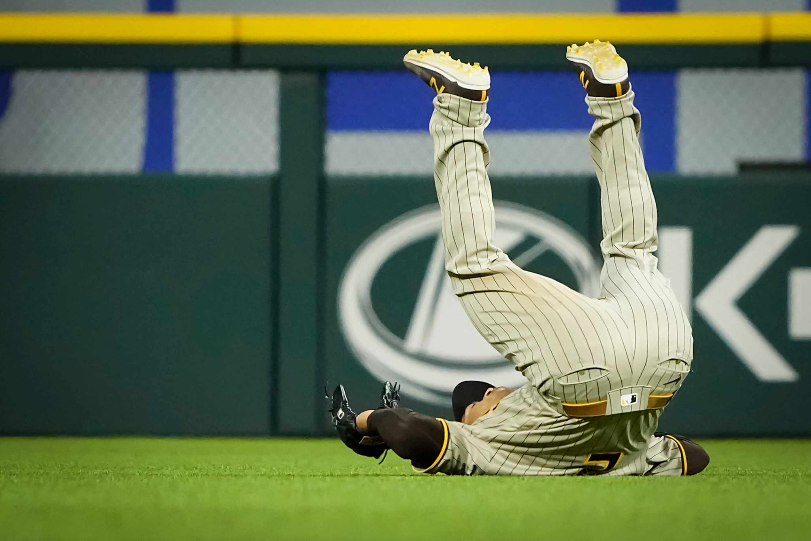 San Diego Padres center fielder Trent Grisham tumbles in celebration after a victory over...