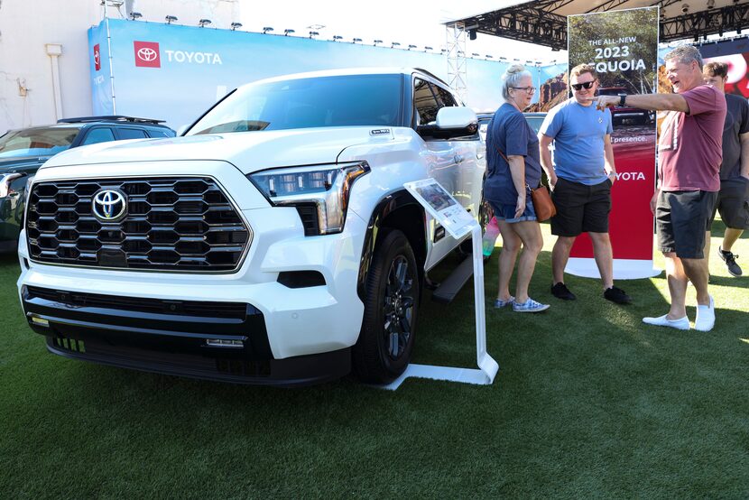 Mike Cook points to a Toyota Sequoia at the auto show, Sunday, Oct. 2, 2022 at Fair Park in...