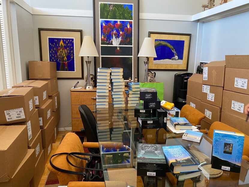 Stacks of boxes hold Benjamin Alire Sáenz's new book, "Aristotle and Dante Dive into the...