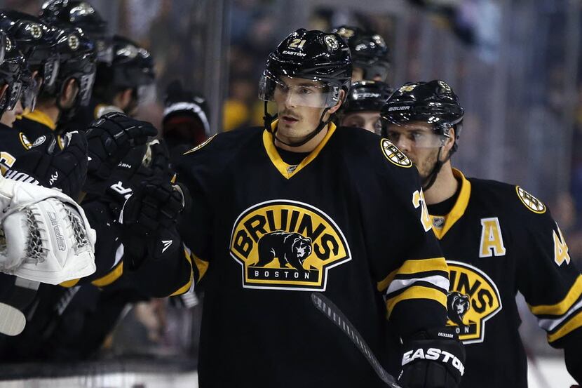 Boston Bruins' Loui Eriksson (21) celebrates his goal during the first period of an NHL...