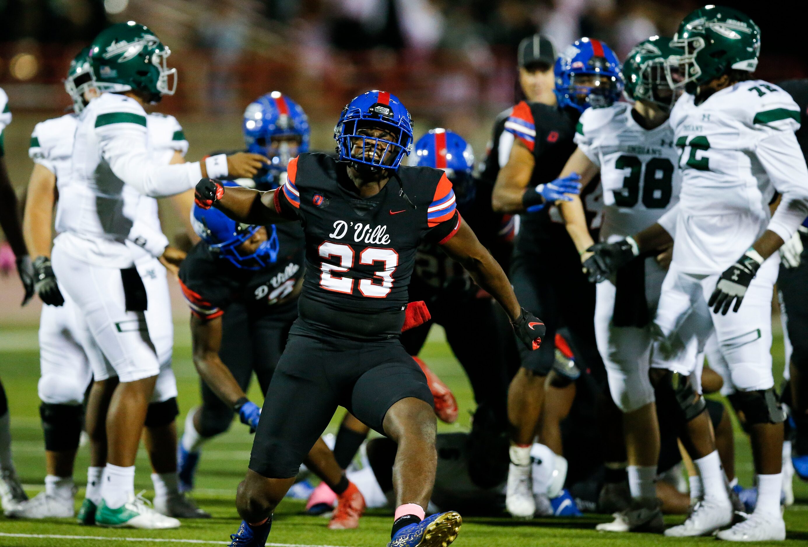 Duncanville senior defensive lineman Omari Abor (23) celebrates a Waxahachie fumble and...