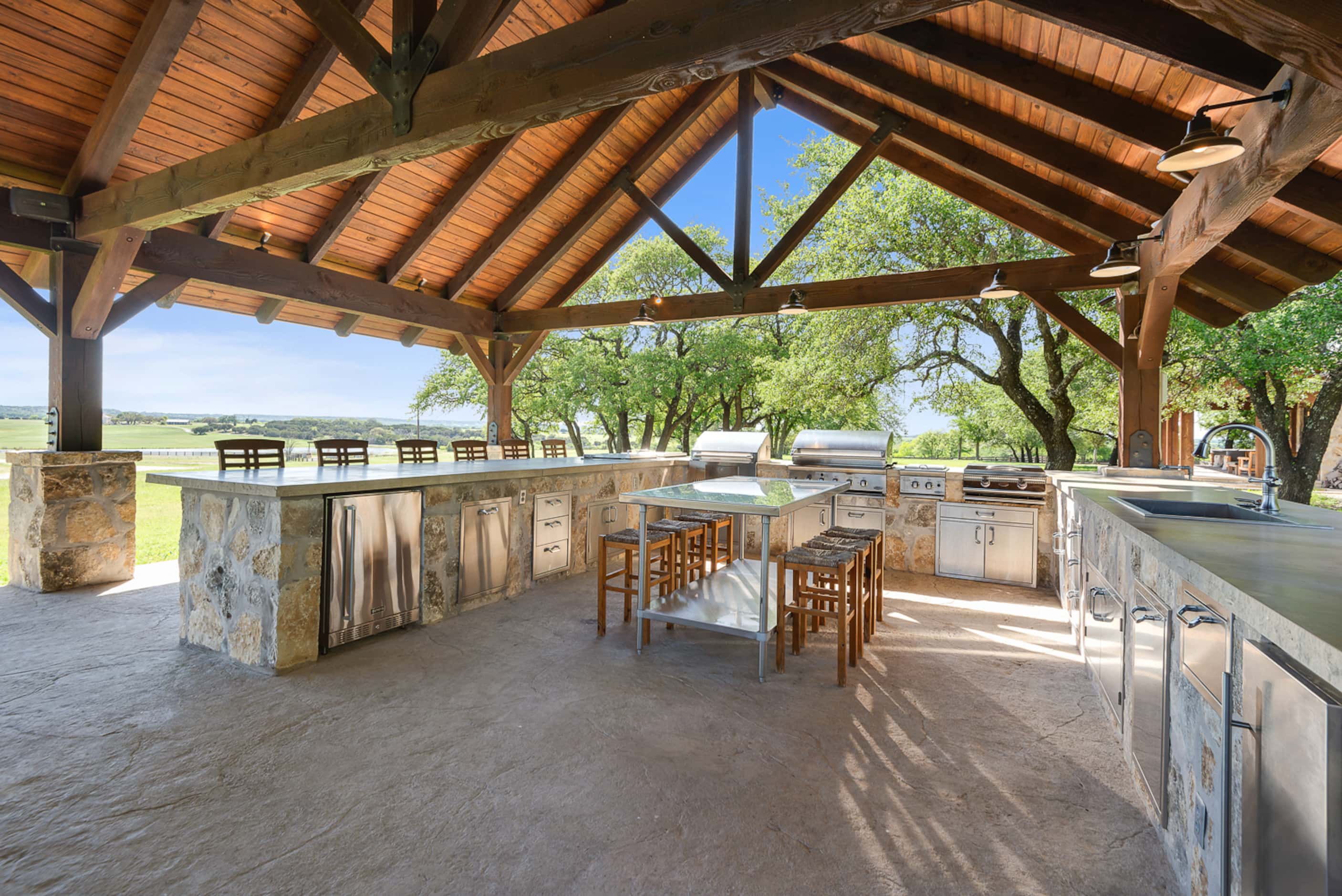 The outdoor kitchen area has ample entertainment space.