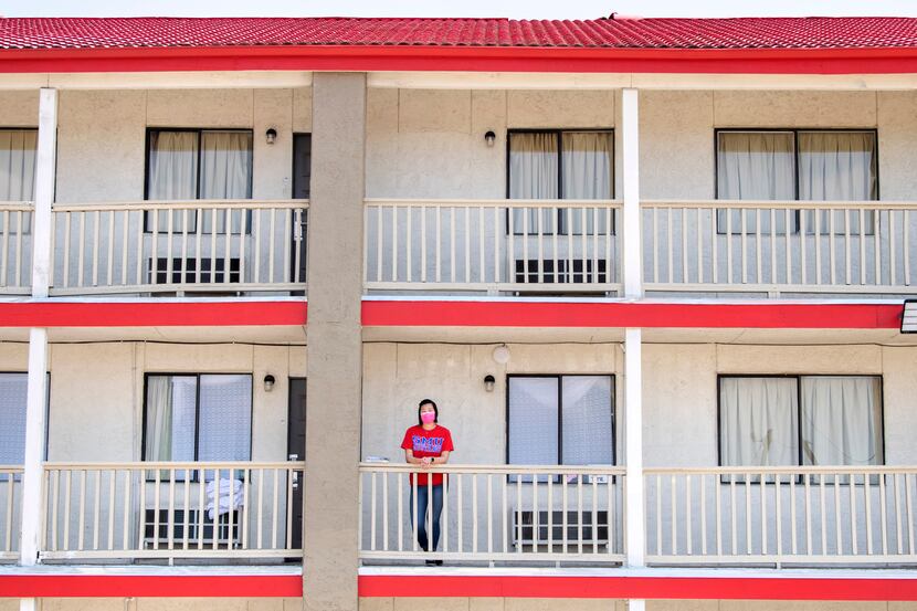 Joie Lew, an 18-year-old freshman at SMU, poses for a portrait outside the OYO Hotel suite...