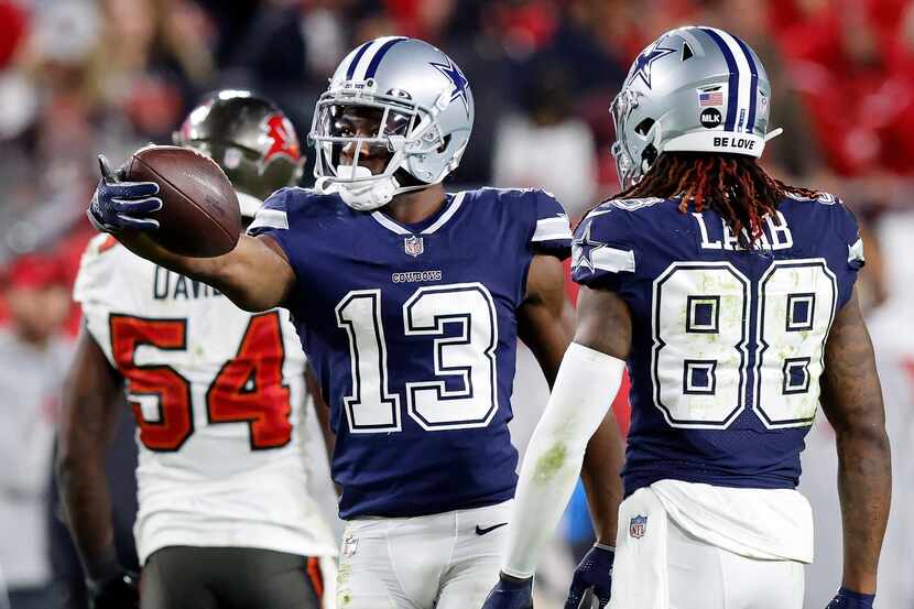 Dallas Cowboys wide receiver Michael Gallup (13) signals first down after making a fourth...