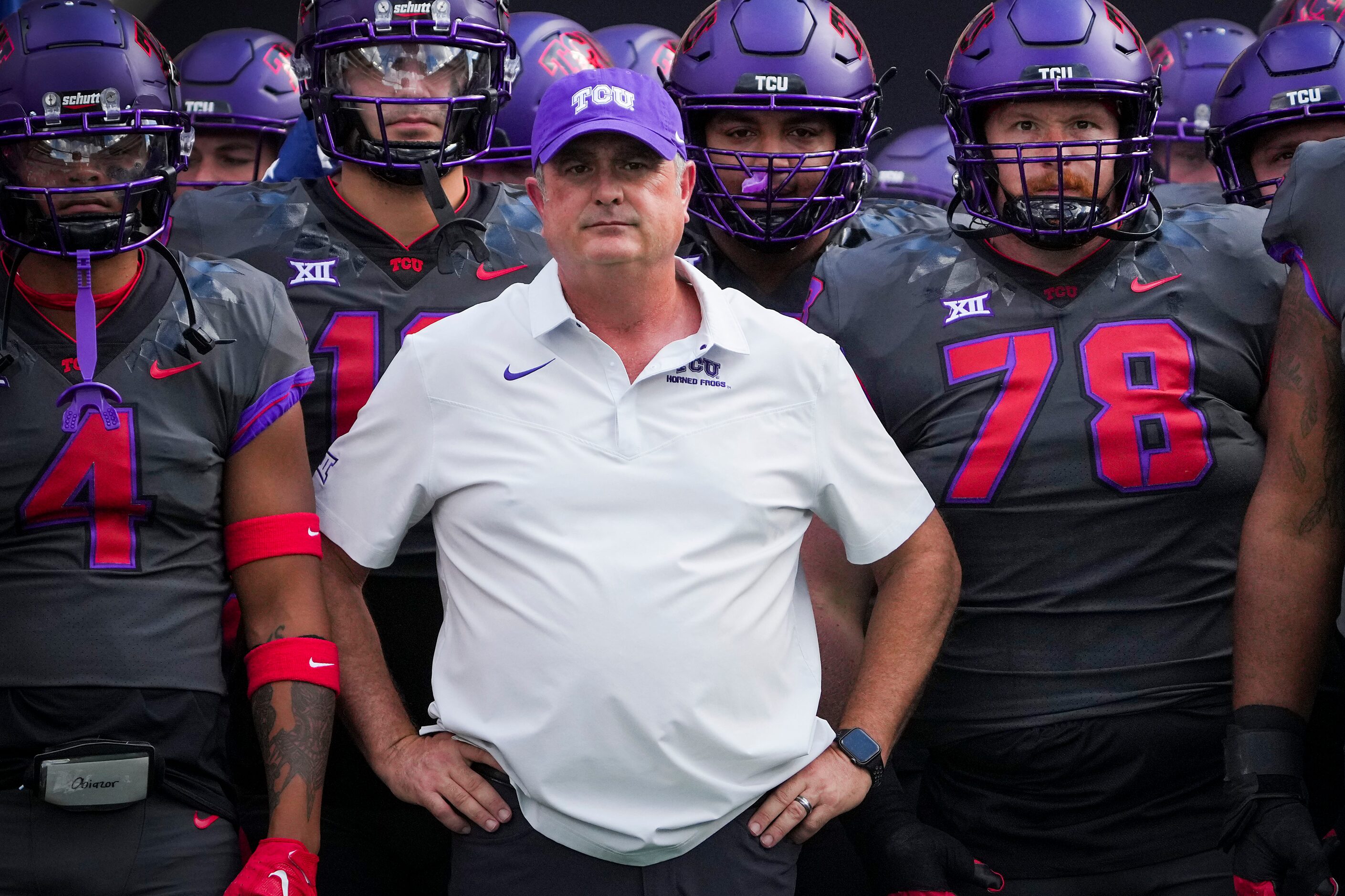 TCU head coach Sonny Dykes waits with his players to take the field before an NCAA football...