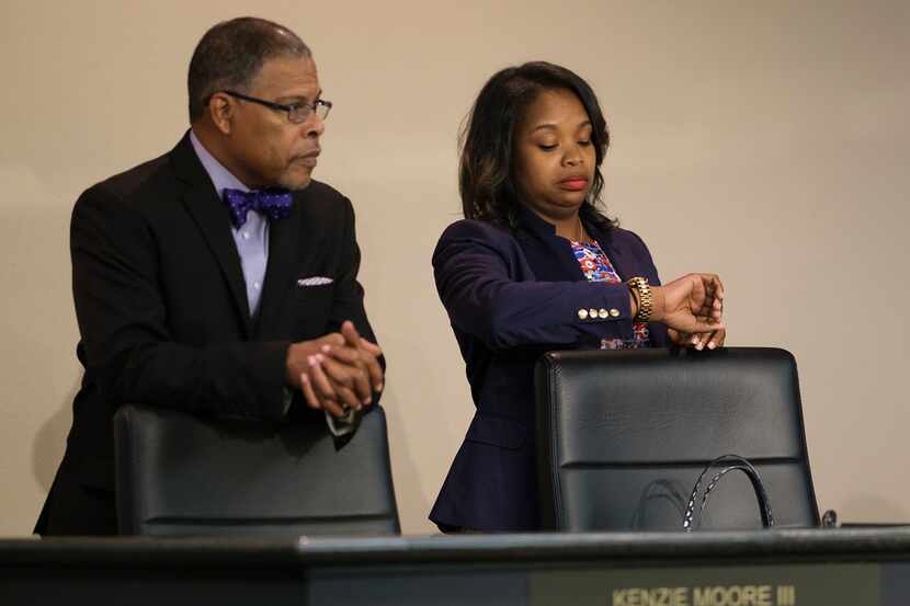 Council member Candice Quarles awaits the start of a recent council meeting where residents...