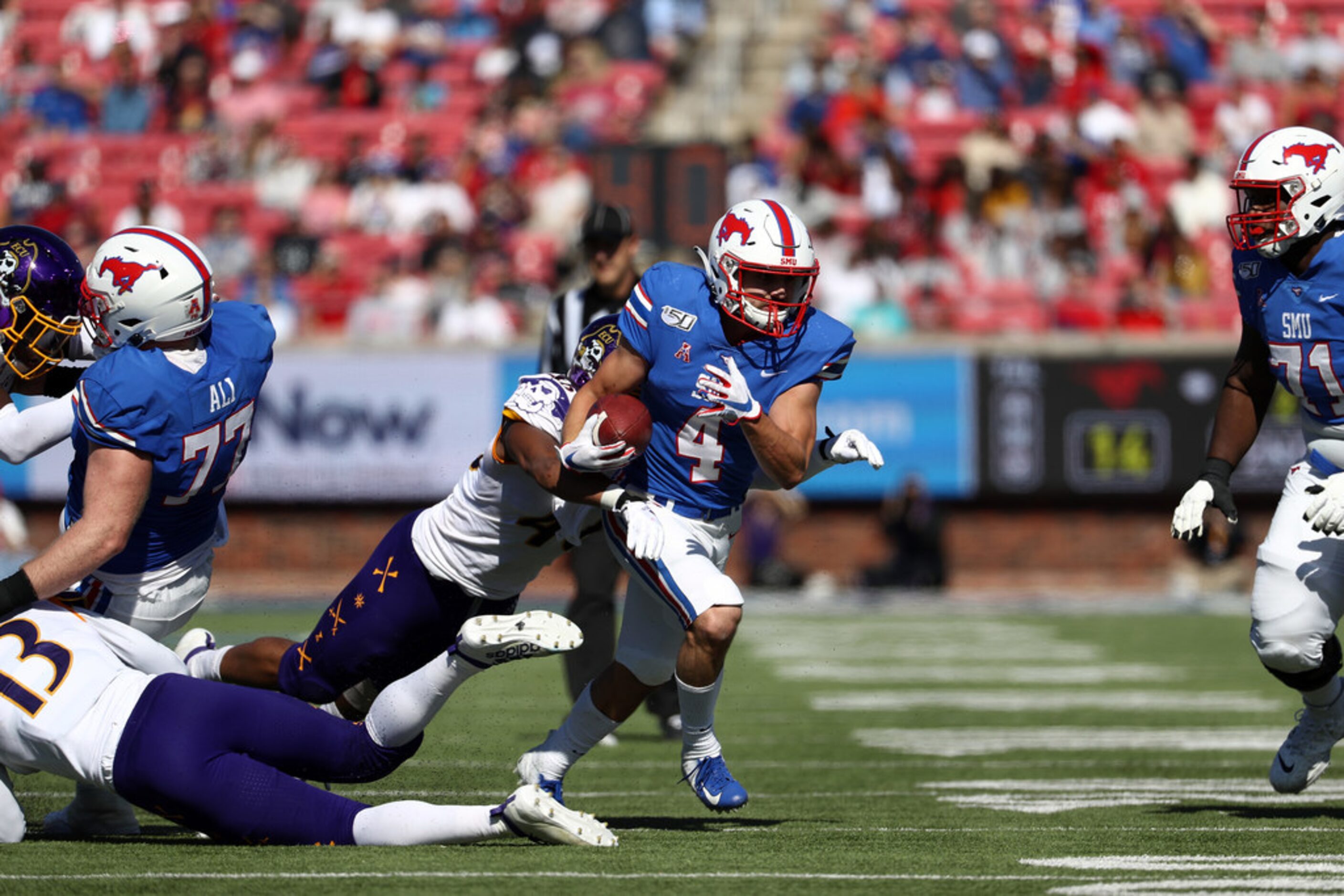 DALLAS, TEXAS - NOVEMBER 09:  Tyler Page #4 of the Southern Methodist Mustangs runs the ball...