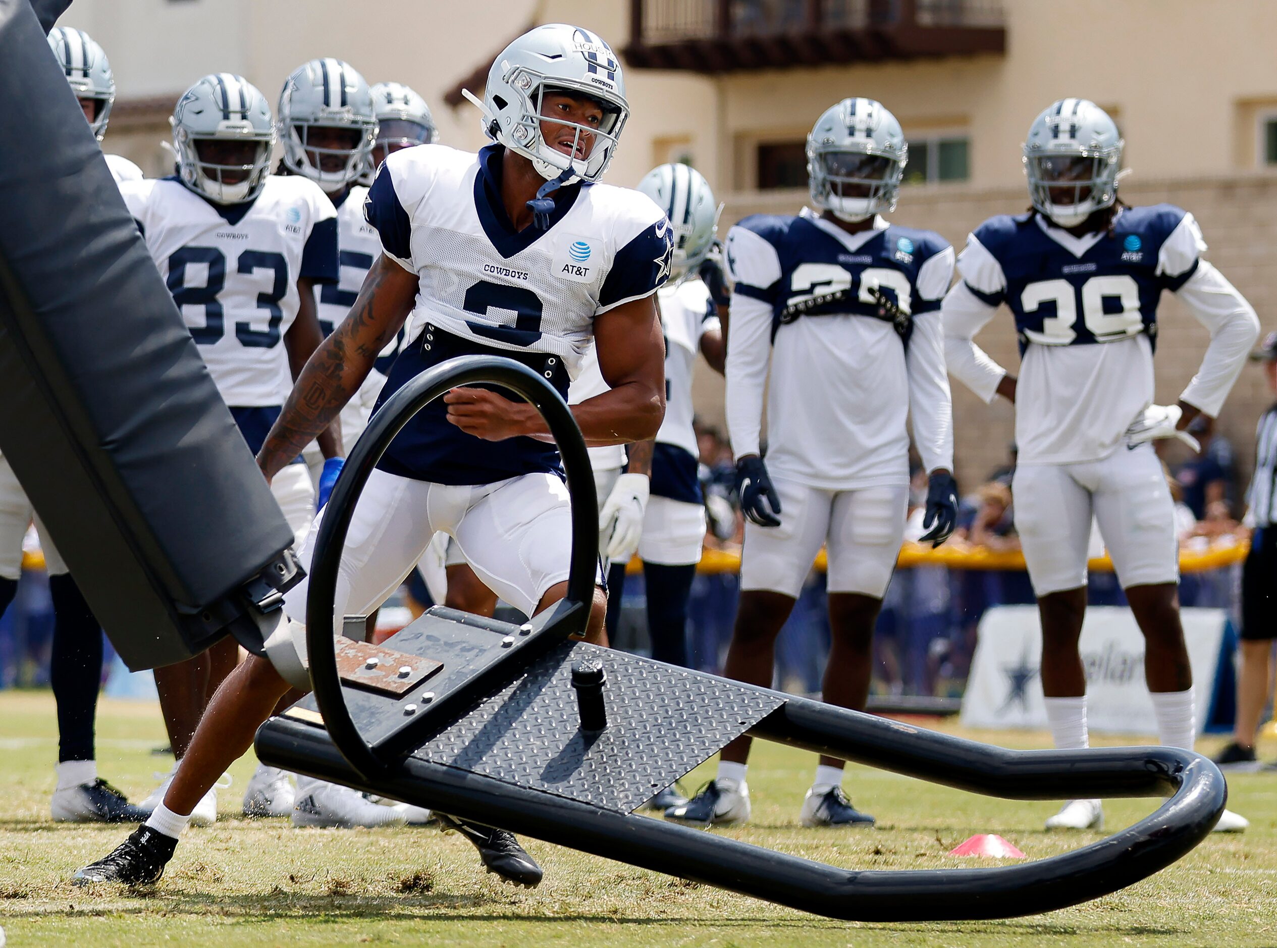 Dallas Cowboys wide receiver Dennis Houston (3) tosses aside the blocking sled during...