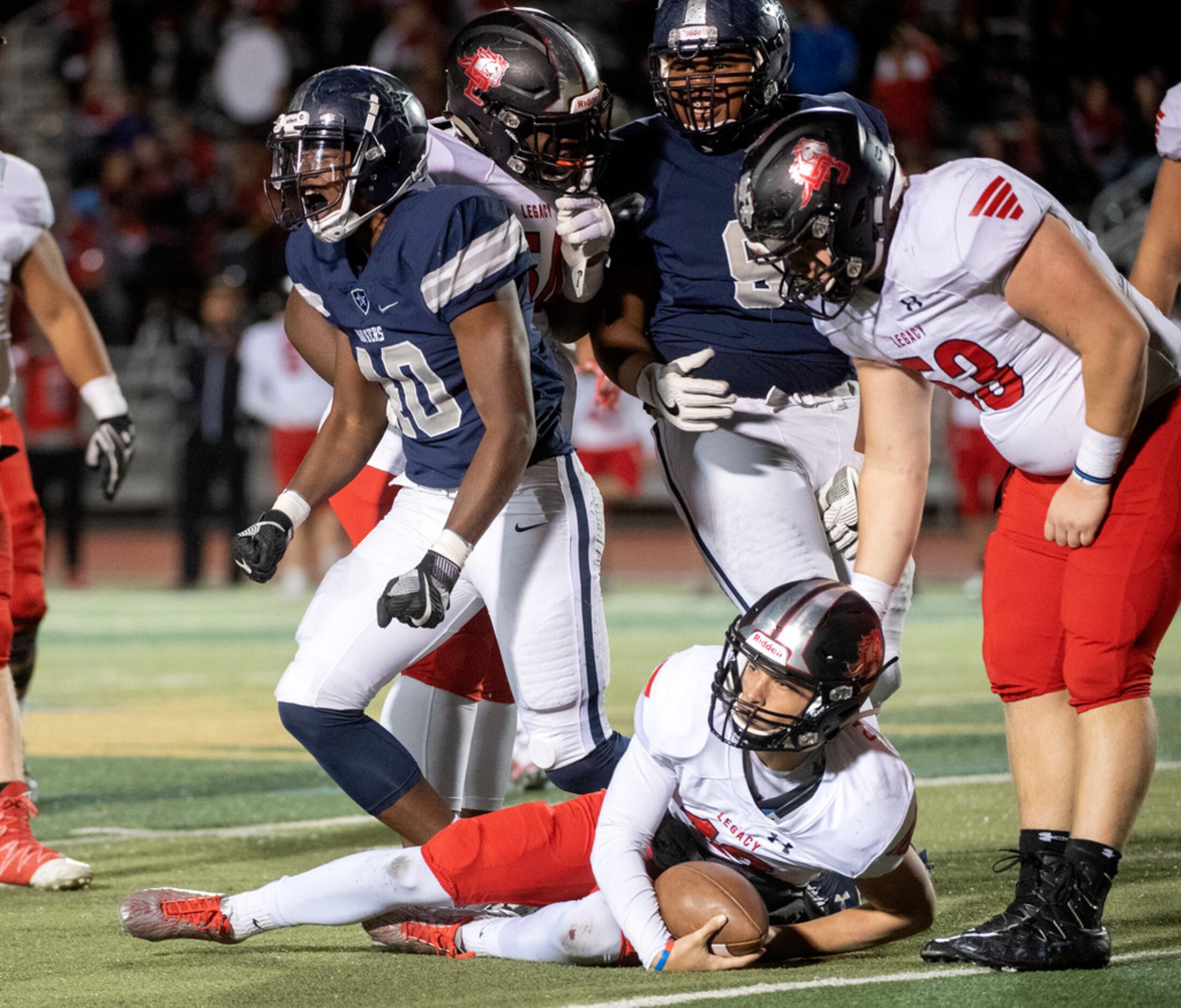 Frisco Lone Star senior linebacker Steve Green (40) celebrates after sacking Mansfield...